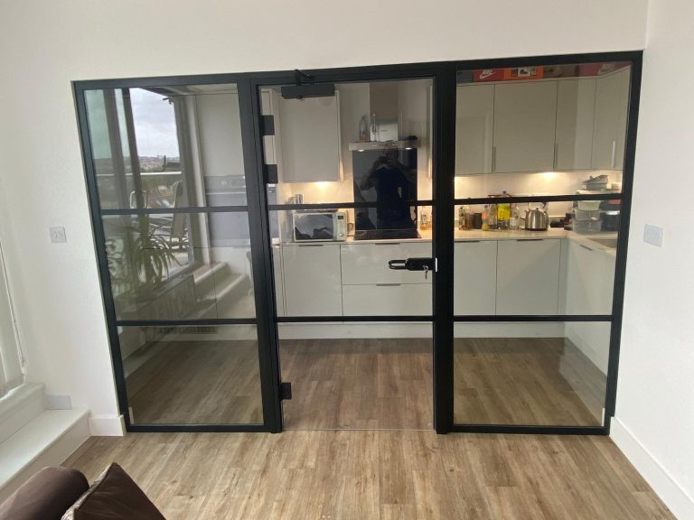 photo of a fire rated glass partition with glass door in a kitchen