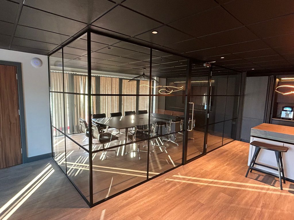 black framed crittall glass partition in a new office fit out.